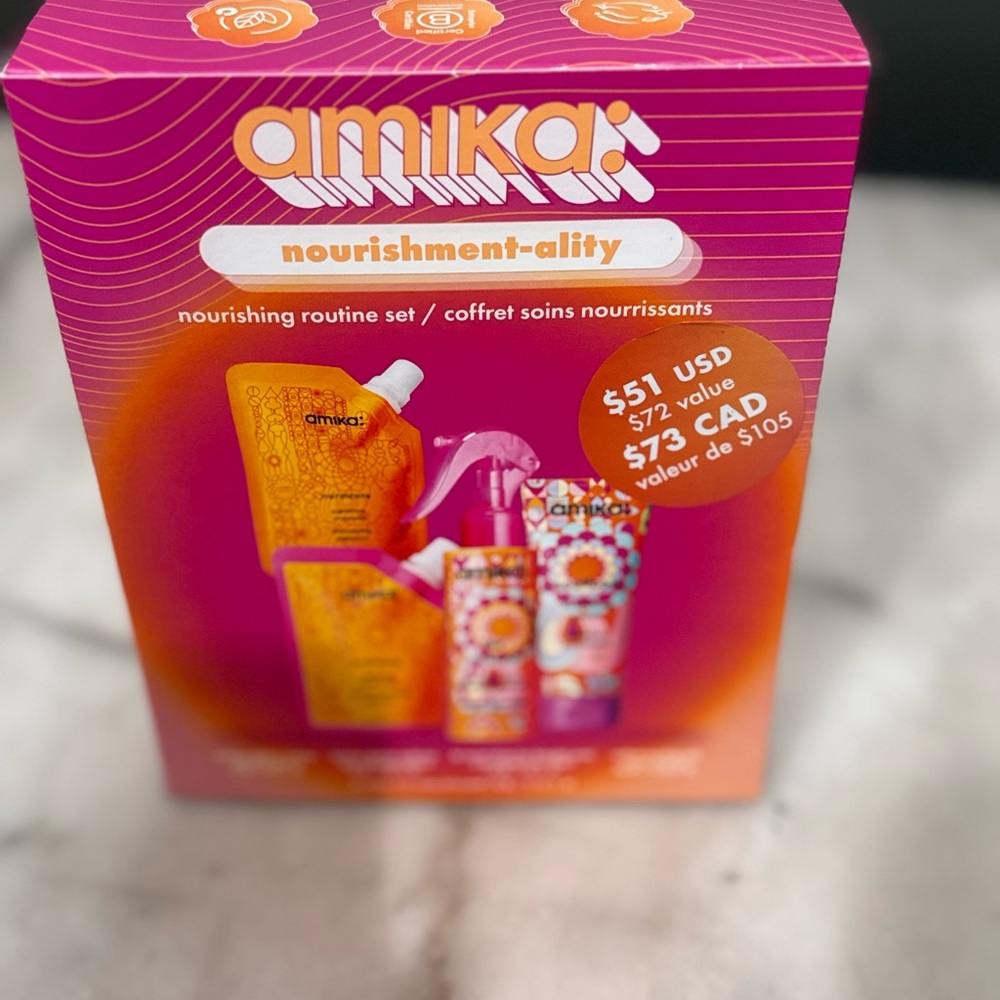 Amika Vibrant Hair Care Set with Orange and Pink Packaging